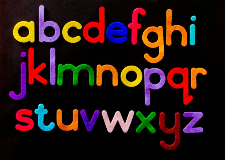Vibrant alphabet letters arranged against a dark background for educational use.